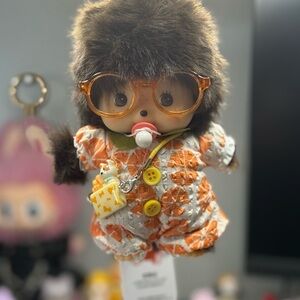 Adorable Baby Monchichi Plush Doll with Orange Outfit and Accessories